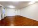 Living room with wood-look floors, neutral walls, and recessed lighting at 22755 W Yavapai St, Buckeye, AZ 85326