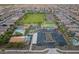 Aerial view of the community amenities including a green space, park, basketball court, and pool at 22962 N 182Nd Ln, Surprise, AZ 85387