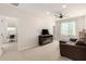 Open bonus room with sofa, TV, and an entertainment center at 22962 N 182Nd Ln, Surprise, AZ 85387