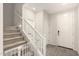 Inviting entryway with gray flooring, staircase, and white doors creates a bright and welcoming atmosphere at 22962 N 182Nd Ln, Surprise, AZ 85387