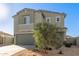 Charming two-story home boasts a neutral color palette, desert landscaping, and a welcoming two-car garage at 22962 N 182Nd Ln, Surprise, AZ 85387