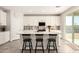 This stylish kitchen features a large island with seating, sleek countertops, and plenty of storage space at 22962 N 182Nd Ln, Surprise, AZ 85387