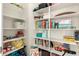 Organized pantry with lots of shelving, baskets, toys, and a clean white design at 22962 N 182Nd Ln, Surprise, AZ 85387