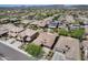 High angle of a neighborhood showing well-kept homes, desert foliage, and paved streets on a sunny day at 29214 N 19Th Ln, Phoenix, AZ 85085