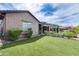 Lush backyard with manicured lawn, covered patio, and vibrant plants perfect for outdoor relaxation at 29214 N 19Th Ln, Phoenix, AZ 85085