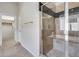 Bathroom showcasing a walk-in glass shower with a tiled surround and bench at 29214 N 19Th Ln, Phoenix, AZ 85085