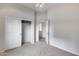 Carpeted bedroom with double closet doors and adjoining doorway at 29214 N 19Th Ln, Phoenix, AZ 85085