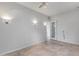 Bright bedroom with tile flooring and a doorway leading to another room at 29214 N 19Th Ln, Phoenix, AZ 85085
