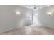 Spacious bedroom featuring neutral-toned tile floor, a ceiling fan, and two sconces at 29214 N 19Th Ln, Phoenix, AZ 85085