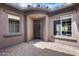 Front entrance with covered courtyard and dark brown door at 29214 N 19Th Ln, Phoenix, AZ 85085