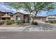 Charming single-Gathering home featuring stone accents, desert landscaping, and a welcoming two-car garage at 29214 N 19Th Ln, Phoenix, AZ 85085