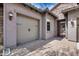 Close up of the two-car garage and courtyard entrance at 29214 N 19Th Ln, Phoenix, AZ 85085
