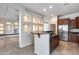 Bright kitchen boasts recessed lighting, cherry cabinetry, granite countertops, and stainless steel appliances at 29214 N 19Th Ln, Phoenix, AZ 85085