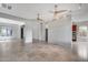 Spacious living room with open concept, tile floors, and recessed lights at 29214 N 19Th Ln, Phoenix, AZ 85085