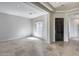 Living room featuring tile floors, large window, and dark wood door at 29214 N 19Th Ln, Phoenix, AZ 85085