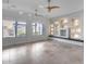 Bright living room with tile flooring, built-in shelving, and large windows offering plenty of natural light at 29214 N 19Th Ln, Phoenix, AZ 85085