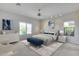 Spacious main bedroom with natural light, a plush bed, and stylish furnishings with neutral color pallete at 29214 N 19Th Ln, Phoenix, AZ 85085
