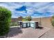 Outdoor kitchen area with a built-in bar, perfect for entertaining guests in the backyard at 29214 N 19Th Ln, Phoenix, AZ 85085