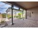 Covered patio with brick floors, pergola and comfortable outdoor living space at 29214 N 19Th Ln, Phoenix, AZ 85085