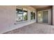 Covered patio with brick floors showcasing seamless indoor-outdoor living through a sliding door at 29214 N 19Th Ln, Phoenix, AZ 85085