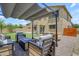 Charming backyard patio featuring comfortable seating and a dining area, perfect for outdoor enjoyment at 3349 E Flamingo Ct, Gilbert, AZ 85297