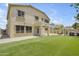 Spacious backyard featuring a well-maintained lawn and a charming patio, perfect for outdoor entertaining at 3349 E Flamingo Ct, Gilbert, AZ 85297