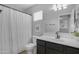 Bathroom with vanity, black hardware, and shower and tub combination at 3349 E Flamingo Ct, Gilbert, AZ 85297