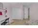 Bedroom with light wood floors has closet and is painted a soft pink at 3349 E Flamingo Ct, Gilbert, AZ 85297