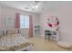 Sunlit bedroom with white desk, chair, and natural light, creating a bright and inviting space at 3349 E Flamingo Ct, Gilbert, AZ 85297