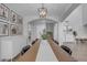 Bonus room featuring modern light fixture, comfortable sofa, TV and storage space at 3349 E Flamingo Ct, Gilbert, AZ 85297