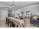 Elegant dining area features modern light fixture and view to the living room at 3349 E Flamingo Ct, Gilbert, AZ 85297