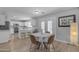 Open-concept kitchen and dining area bathed in natural light from large windows at 3349 E Flamingo Ct, Gilbert, AZ 85297