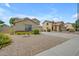 Picture of several beige houses with beautiful desert landscaping at 3349 E Flamingo Ct, Gilbert, AZ 85297
