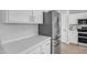 Close-up of kitchen showcasing stainless steel refrigerator and white countertops at 3349 E Flamingo Ct, Gilbert, AZ 85297