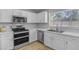 Updated kitchen featuring stainless steel appliances and a bright window at 3349 E Flamingo Ct, Gilbert, AZ 85297