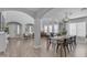 Open-concept living area featuring a long dining table with view to the sitting area at 3349 E Flamingo Ct, Gilbert, AZ 85297