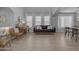 Open-concept living area with natural light, piano, couch and modern furniture at 3349 E Flamingo Ct, Gilbert, AZ 85297
