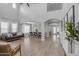 Spacious living room boasts an open floor plan, high ceilings, and wood floors at 3349 E Flamingo Ct, Gilbert, AZ 85297