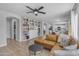 Spacious living room with a built-in bookshelf and views into the kitchen area at 3349 E Flamingo Ct, Gilbert, AZ 85297