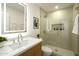 Modern bathroom with a glass-enclosed shower, floating vanity, and sleek fixtures at 3413 N 87Th Pl, Scottsdale, AZ 85251