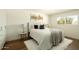 Well-lit bedroom featuring a comfortable queen-size bed, stylish lamps, and a cozy shag rug at 3413 N 87Th Pl, Scottsdale, AZ 85251
