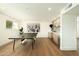 Bright game room with a ping pong table, modern bar area, hardwood floors and large windows at 3413 N 87Th Pl, Scottsdale, AZ 85251