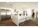 Bright and modern kitchen featuring a large island with seating, stainless steel appliances, and elegant countertops at 3413 N 87Th Pl, Scottsdale, AZ 85251