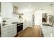 Well-lit kitchen featuring white cabinets, modern appliances, and sleek countertops, perfect for cooking and entertaining at 3413 N 87Th Pl, Scottsdale, AZ 85251