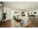 Spacious living room with hardwood floors, plush seating, and a modern fireplace, ideal for relaxation and entertaining at 3413 N 87Th Pl, Scottsdale, AZ 85251