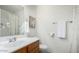 Bright bathroom featuring a wood vanity, framed mirror, neutral paint, and a shower/tub combo with modern fixtures at 3511 E Baseline Rd # 1235, Phoenix, AZ 85042