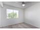 Serene bedroom with natural light streaming through the window, ceiling fan, and neutral carpet to create a calm retreat at 3511 E Baseline Rd # 1235, Phoenix, AZ 85042