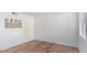 Simple bedroom with wood-look floors and window at 3511 E Baseline Rd # 1235, Phoenix, AZ 85042
