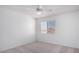 Neutral bedroom with a ceiling fan and window offering natural light, creating a serene and comfortable living space at 3511 E Baseline Rd # 1235, Phoenix, AZ 85042