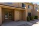 Inviting condo exterior featuring a tan exterior with stone accents and well-maintained landscaping, creating curb appeal at 3511 E Baseline Rd # 1235, Phoenix, AZ 85042